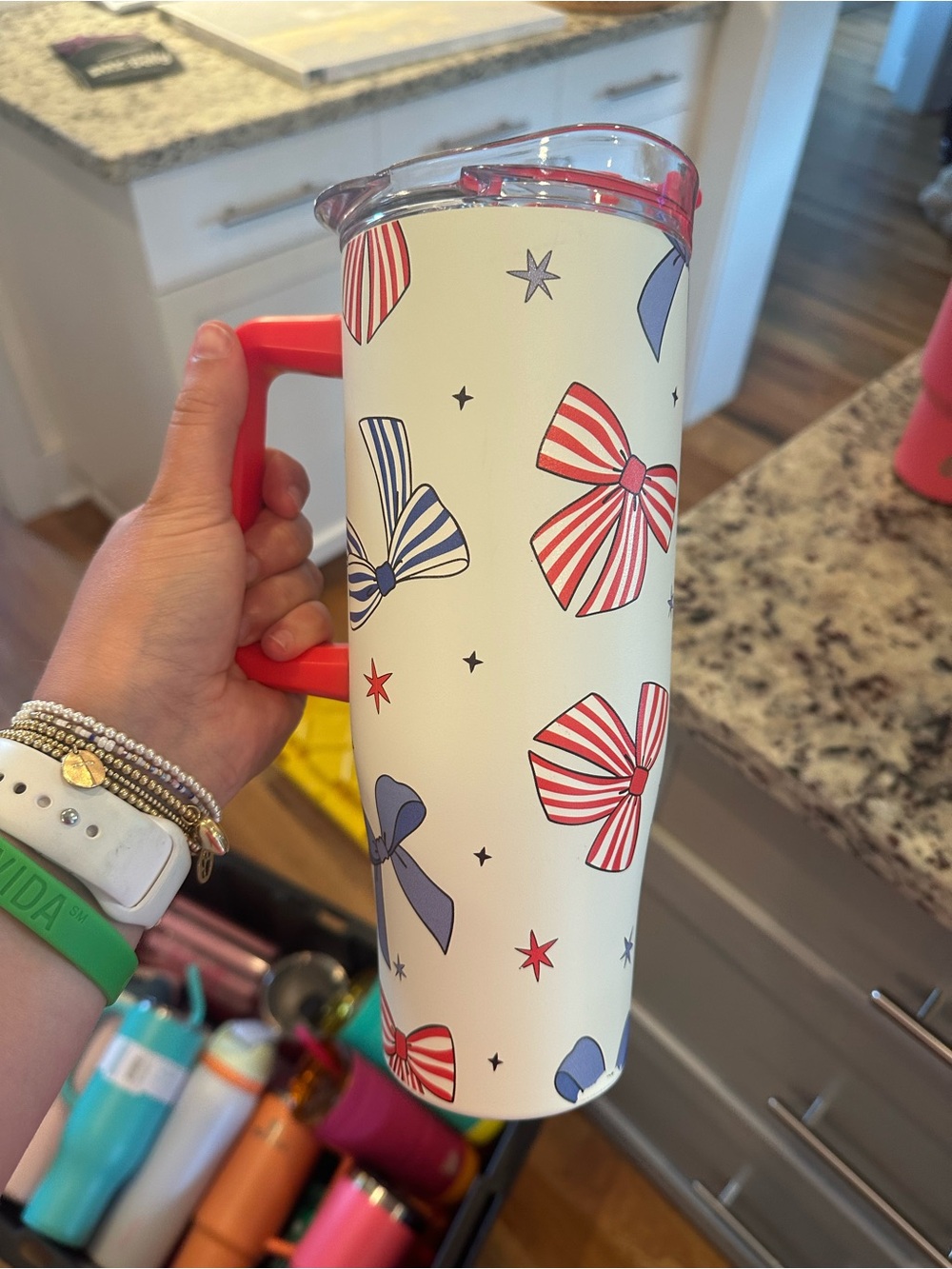 White tumbler with Red & Blue Bow Pattern and Red Handle